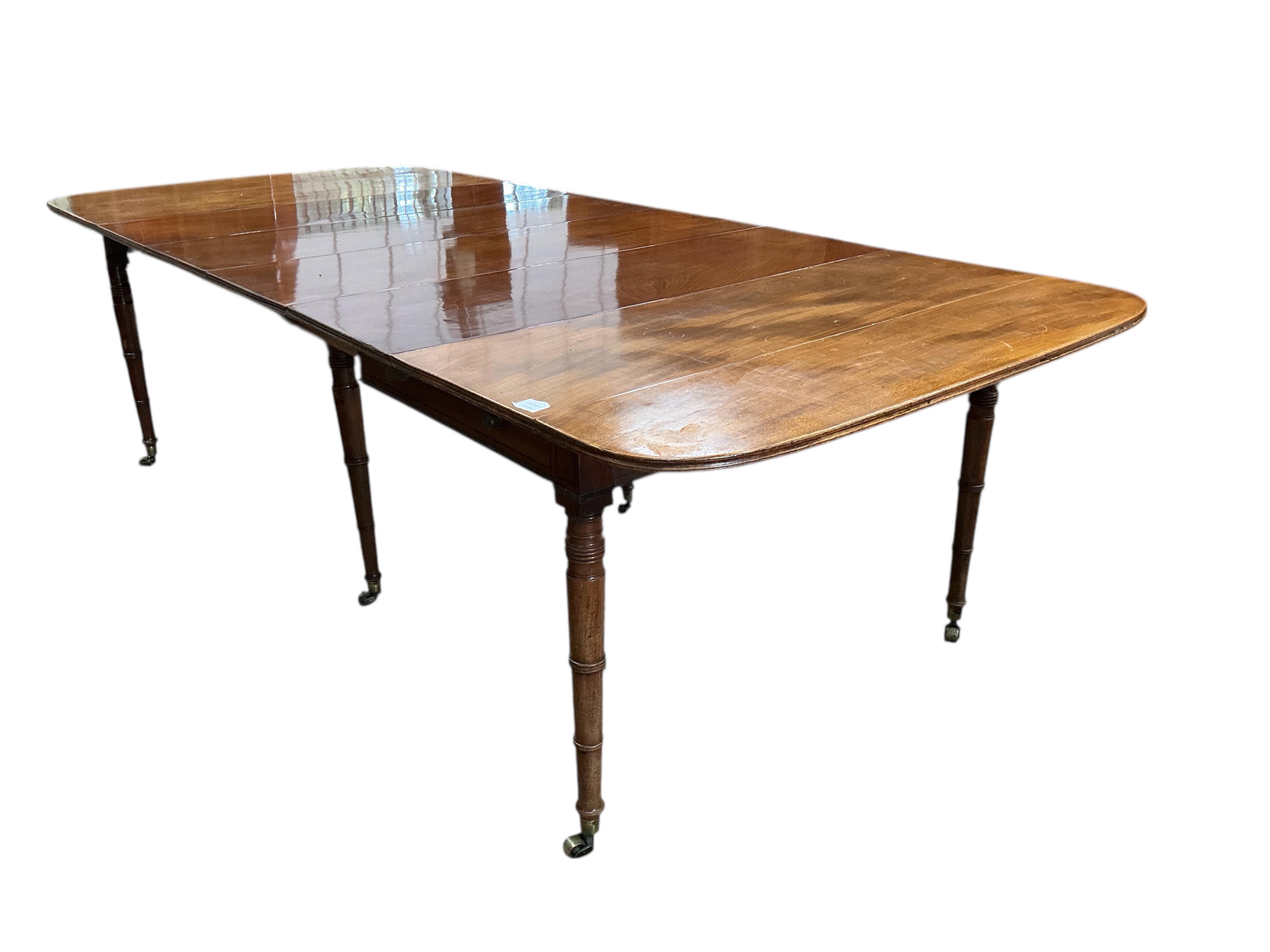 A Regency mahogany Pembroke extending dining table, width 258cm extended, depth 114cm, height 73cm